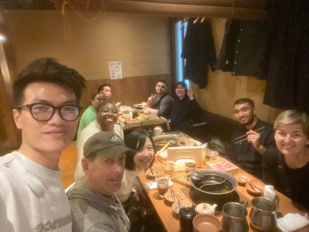 group selfie in a hot pot restaurant