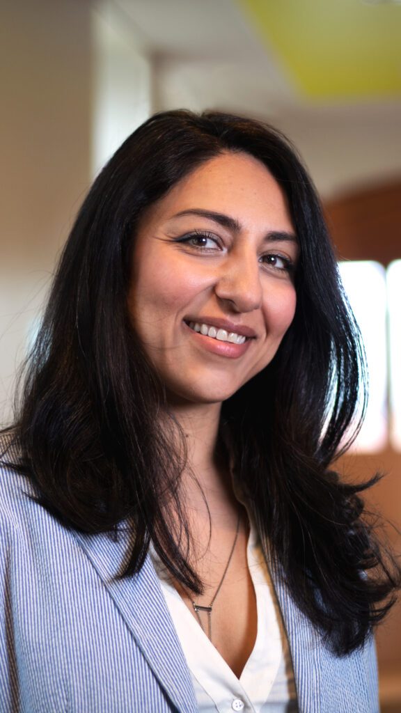 A woman smiling.
