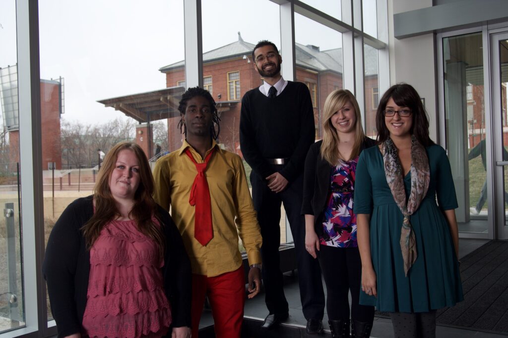 Teresa Silva-Byers is posing for a picture with other HSF executives.