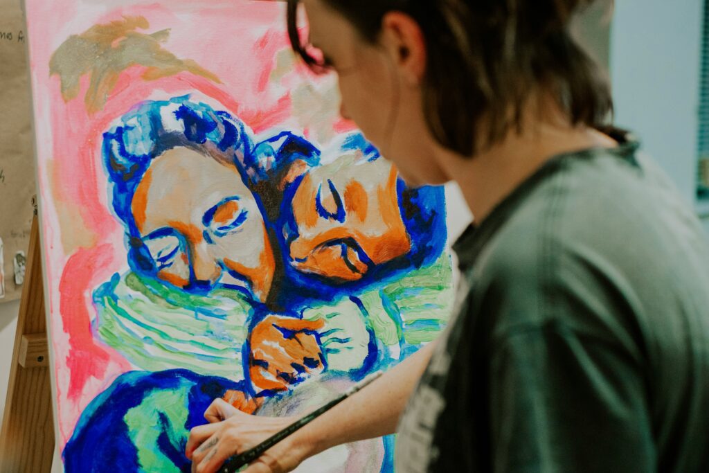 A person painting on a canvas