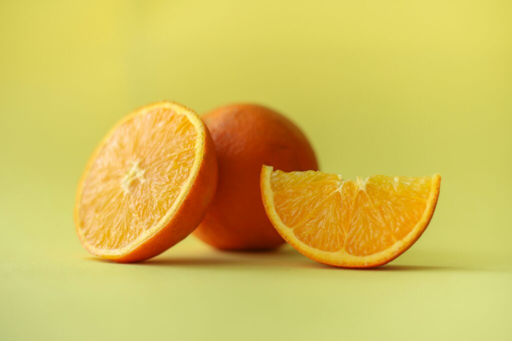 Sliced orange on a green background.