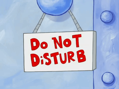 Do not disturb sign hanging on door knob from Spongebob Squarepants