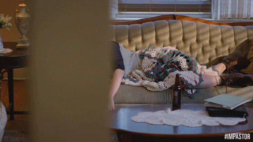 a woman sleeping on a couch
