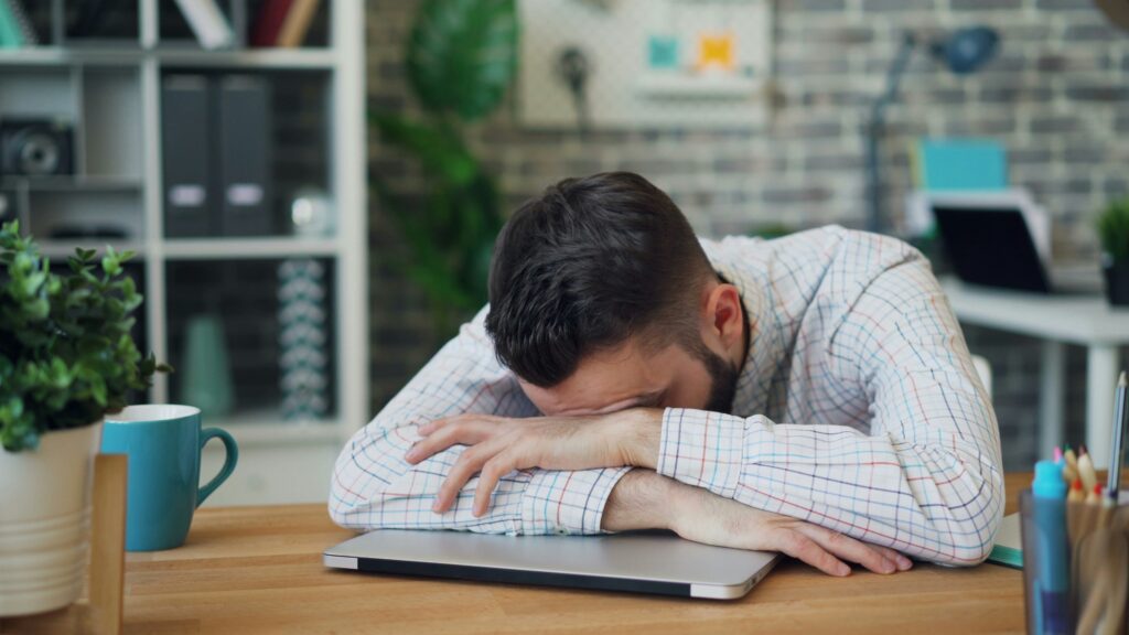 a man napping at his desk