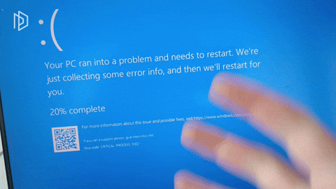 A frustrated fist annoyed at a "PC restarting screen" 