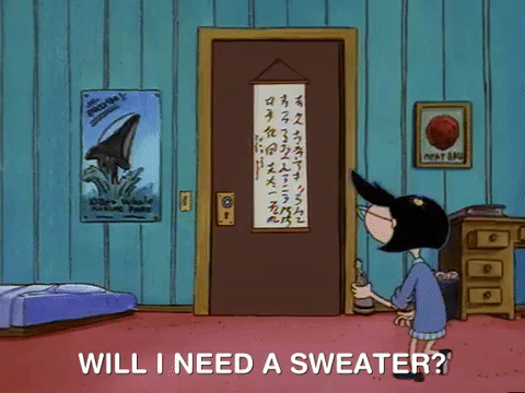 cartoon girl with black hair entering a brown door in a bedroom with blue walls and red carpet. Text at the bottom of the image reads "Will I need a sweater?".