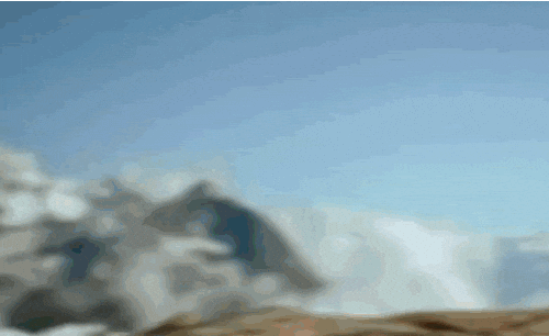 a kid on top of a hill with binoculars and a flag