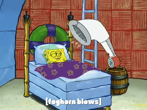 Spongebob Squarepants sleeps peacefully in his bed as his foghorn alarm clock blows. 