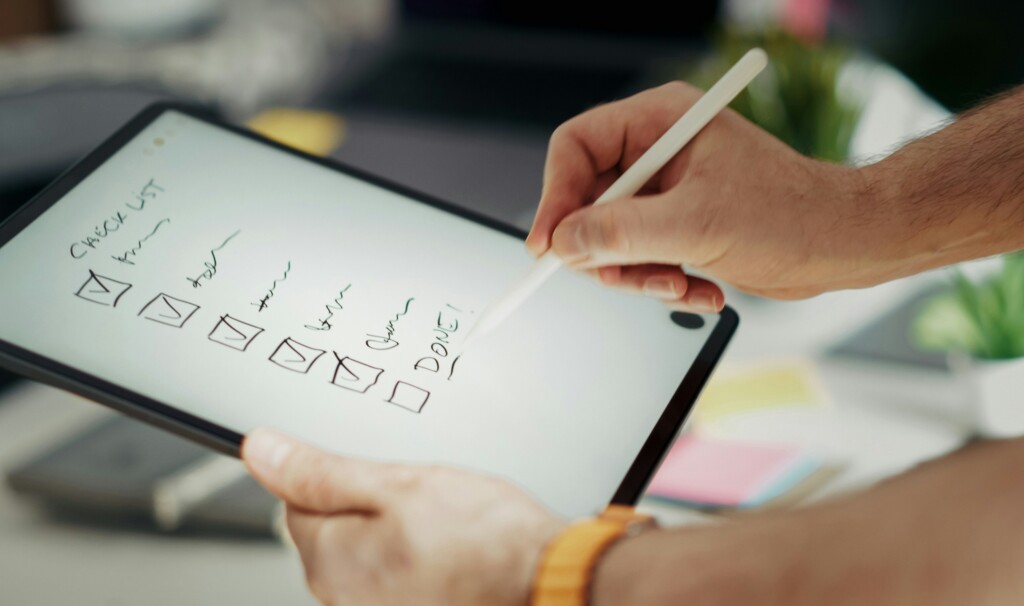 An ipad with a checklist drawn on, with an smart pen